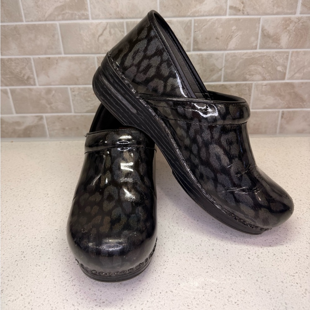 Dansko Black Leopard Print Clogs - image 1